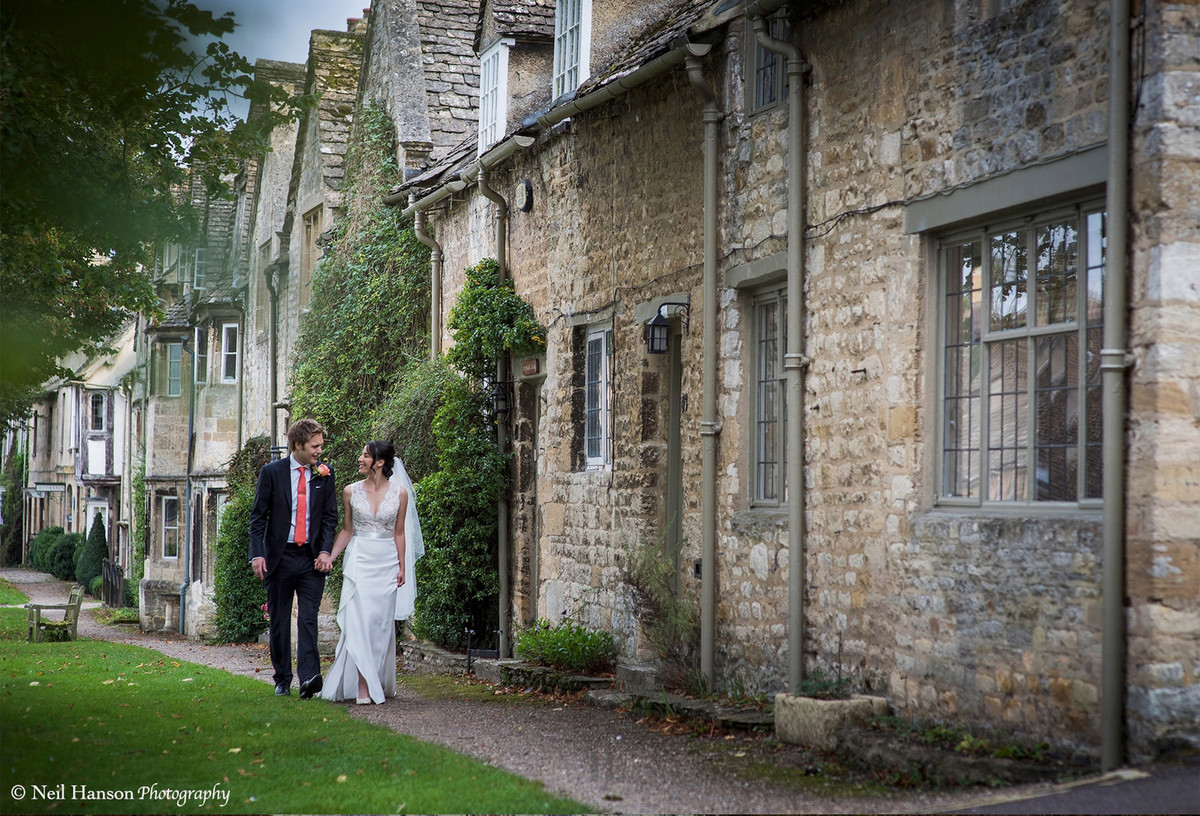 Bride and Groom exploring the Cotswold town of Burford after their wedding at The Bay Tree Hotel
