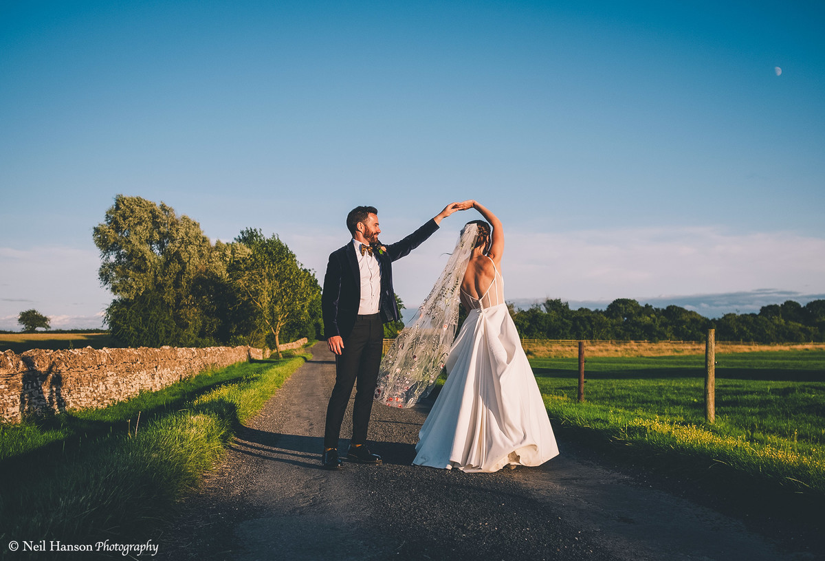 Bride and groom on their wedding day at Oxleaze Barn